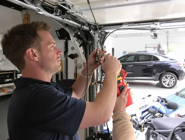 Fountainebleau Garage Door Repair safety certified technician performing cable replacement in Fountainebleau