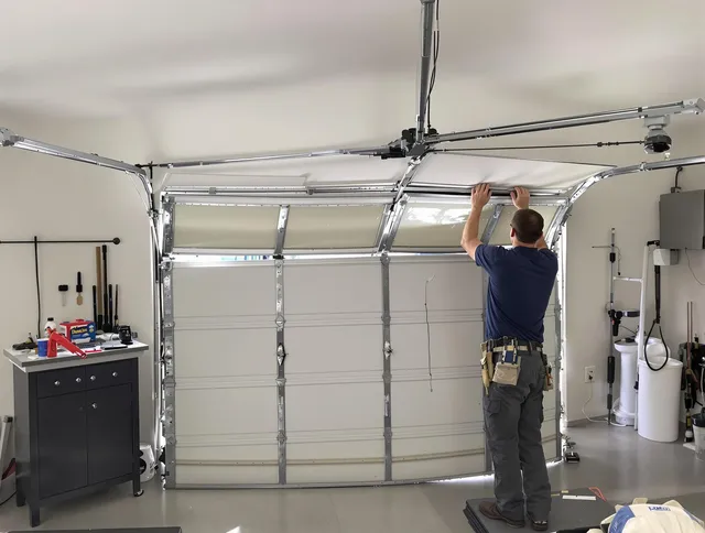 Fountainebleau Garage Door Repair specialist performing precise section replacement on Fountainebleau garage door
